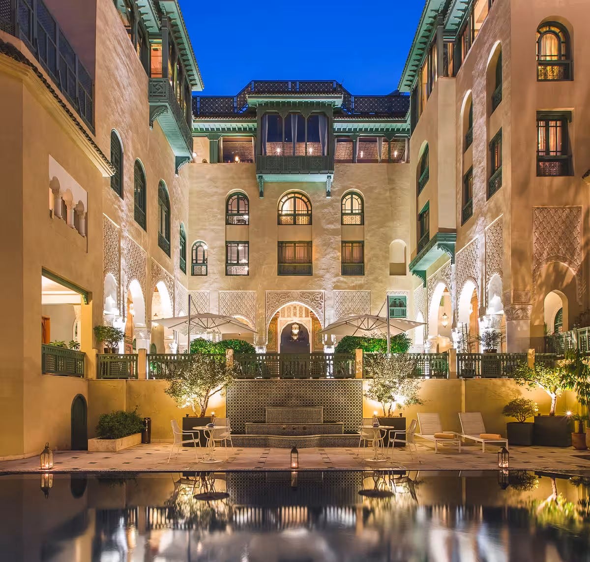 Palais Faraj luxury hotel exterior at dusk